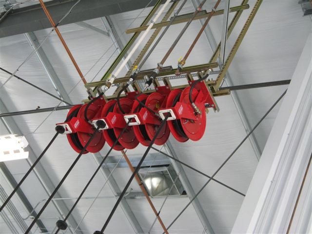 In addition to safety benefits from keeping hoses off the shop floor, hose reels allows a shop to buy lubricant products in bulk, yet still deliver fluid to each bay as needed.